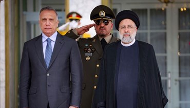 الرئيس الإيراني إبراهيم رئيسي يستقبل رئيس الوزراء العراقي مصطفى الكاظمي في العاصمة طهران (أ ف ب).