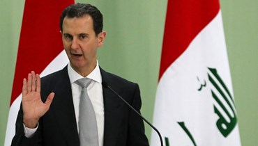 صورة ارشيفية- الأسد متكلما خلال مؤتمر صحافي مع رئيس الوزراء العراقي (ليس في الصورة) في دمشق في تموز 2023 (أ ف ب).
