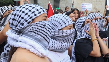 متظاهرون مناصرون لغزّة في رام الله (أ ف ب).